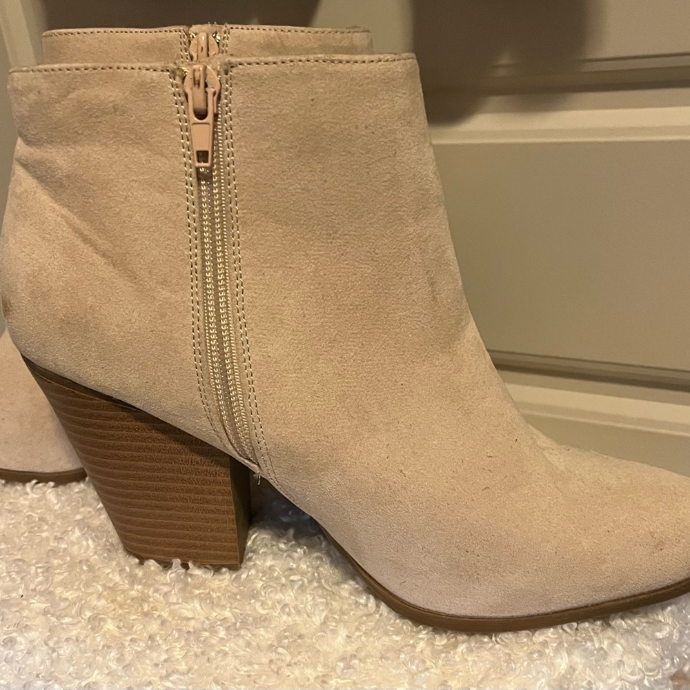 Asymmetric ankle booties.